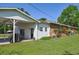 Back exterior view of the home and the covered patio, perfect for outdoor enjoyment and entertaining at 4196 E Highway 319, Conway, SC 29526