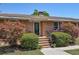 Welcoming brick home entrance with a beautifully landscaped walkway and charming front door at 4196 E Highway 319, Conway, SC 29526