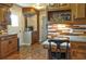 Cozy kitchen featuring granite countertops, wood cabinetry, and a built-in coffee bar at 4196 E Highway 319, Conway, SC 29526