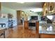 Open-concept kitchen featuring stainless steel appliances, granite countertops, and hardwood flooring at 4196 E Highway 319, Conway, SC 29526