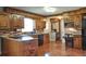 Spacious kitchen featuring wood cabinetry, granite counters, and stainless appliances at 4196 E Highway 319, Conway, SC 29526