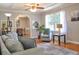 Comfortable living room featuring neutral tones, hardwood floors, and a view into the dining area at 4196 E Highway 319, Conway, SC 29526