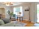 Cozy living room showcasing stylish furniture, hardwood floors, and a large window with natural light at 4196 E Highway 319, Conway, SC 29526