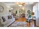 Bright and airy living room featuring stylish furniture, hardwood floors, and a seamless flow to the dining room at 4196 E Highway 319, Conway, SC 29526