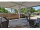 Covered patio with brick lattice, perfect for outdoor dining and entertaining with views of the backyard and adjacent home at 4196 E Highway 319, Conway, SC 29526