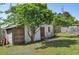 Old shed on a grassy property, providing storage space and rustic charm, with mature trees surrounding it at 4196 E Highway 319, Conway, SC 29526