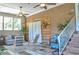 Inviting sunroom with comfortable seating, brick accents, and natural light at 4196 E Highway 319, Conway, SC 29526