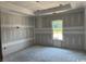 Unfinished bedroom showcasing neutral walls and a window, ready to be designed as you wish at 4268 Long Avenue Ext., Conway, SC 29526