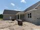 New brick home with a covered porch and large windows, waiting for landscaping and final touches at 4268 Long Avenue Ext., Conway, SC 29526