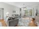 Cozy living room featuring hardwood floors, ceiling fan, and sliding glass doors at 4325 Deer Run Ave., Little River, SC 29566