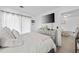 Cozy bedroom featuring neutral decor, a mounted TV, and an open doorway to another room at 4712 Cobblestone Dr. # K-7, Myrtle Beach, SC 29577