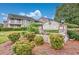 Community entrance showcasing well-maintained landscaping and the 'Cobblestone' sign at 4712 Cobblestone Dr. # K-7, Myrtle Beach, SC 29577