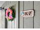 Close-up of a unit front door featuring a decorative floral wreath and unit number K-7 at 4712 Cobblestone Dr. # K-7, Myrtle Beach, SC 29577