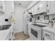 Clean kitchen design with white cabinets and appliances, featuring bright lighting at 4712 Cobblestone Dr. # K-7, Myrtle Beach, SC 29577
