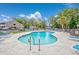Outdoor pool surrounded by lounge chairs and lush greenery within a gated community at 4712 Cobblestone Dr. # K-7, Myrtle Beach, SC 29577