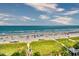 Beach view with blue ocean and populated beach in the distance at 4800 S Ocean Blvd. # 708, North Myrtle Beach, SC 29582