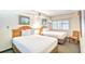 Comfortable bedroom with two cozy beds and a bright, airy feel with light streaming in at 4800 S Ocean Blvd. # 708, North Myrtle Beach, SC 29582
