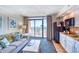Cozy living room with ocean view and access to a private balcony, plus a convenient kitchenette at 4800 S Ocean Blvd. # 708, North Myrtle Beach, SC 29582