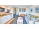Open living area with a kitchen, dining, and sleeper sofa perfect for relaxation at 4800 S Ocean Blvd. # 708, North Myrtle Beach, SC 29582