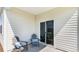 Cozy covered patio with seating and outdoor access to the backyard at 481 Blissful Ln., Little River, SC 29566
