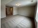 A carpeted bonus room with natural light boasts a comfortable and versatile space at 484 Honeyhill Loop, Conway, SC 29526
