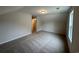 A carpeted bonus room with natural light boasts a comfortable and versatile space at 484 Honeyhill Loop, Conway, SC 29526