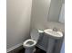 Clean half bathroom featuring a pedestal sink, toilet, and neutral wall paint at 484 Honeyhill Loop, Conway, SC 29526