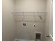 This laundry room offers convenience with its white wire shelving and readily accessible hookups at 484 Honeyhill Loop, Conway, SC 29526