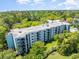 Aerial view of the condo complex surrounded by lush landscaping at 5001 Little River Rd. # 501E, Myrtle Beach, SC 29577