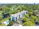 Aerial view of condo with golf course, pond, swimming pool, and parking lot views at 5001 Little River Rd. # 501E, Myrtle Beach, SC 29577