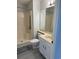 Bathroom featuring a walk-in shower with safety bars, vanity, and gray flooring at 5001 Little River Rd. # 501E, Myrtle Beach, SC 29577