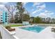 Inviting outdoor pool with a fence, lounge area, and a clear view of the building and golf course at 5001 Little River Rd. # 501E, Myrtle Beach, SC 29577