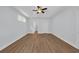 Large bedroom featuring a tray ceiling, ceiling fan, and neutral paint at 5132 Little River Neck Rd., North Myrtle Beach, SC 29582