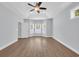 Spacious bedroom with tray ceiling, ceiling fan, and a large bay window at 5132 Little River Neck Rd., North Myrtle Beach, SC 29582