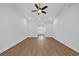 Large living room with ceiling fan and smooth floors flowing into the front entrance at 5132 Little River Neck Rd., North Myrtle Beach, SC 29582