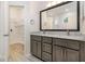 Bathroom features a double sink vanity with granite countertops and an attached walk in closet at 2934 Midiron Ct., Myrtle Beach, SC 29577