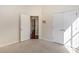 Bedroom featuring carpeted floors, a ceiling fan, and an attached closet and doorway at 2934 Midiron Ct., Myrtle Beach, SC 29577