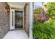 Inviting front porch with brick facade and vibrant flowering shrubbery at 2934 Midiron Ct., Myrtle Beach, SC 29577