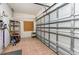 Spacious garage area with a convenient metal storage shelf for tools and equipment organization at 2934 Midiron Ct., Myrtle Beach, SC 29577
