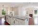 Stylish kitchen island with marble countertops and stainless steel appliances, open to the living area at 2934 Midiron Ct., Myrtle Beach, SC 29577