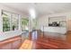 Bright open-concept living area with hardwood floors, large windows, and an open kitchen at 2934 Midiron Ct., Myrtle Beach, SC 29577