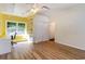 This home office has wood flooring, a window, and shelving units attached to the wall at 2934 Midiron Ct., Myrtle Beach, SC 29577