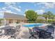 Community pool area featuring multiple seating options and mature landscaping at 2934 Midiron Ct., Myrtle Beach, SC 29577