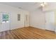 An empty room featuring wood floors, a window, and a white door at 2934 Midiron Ct., Myrtle Beach, SC 29577