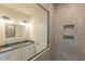 Bathroom featuring double sink vanity with granite countertops and tiled shower at 549 Honeyhill Loop, Conway, SC 29526