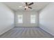 Spacious bedroom featuring large windows and a ceiling fan at 549 Honeyhill Loop, Conway, SC 29526