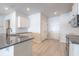 Modern kitchen with stainless steel appliances, granite countertops, a central island, and convenient access to a pantry at 549 Honeyhill Loop, Conway, SC 29526