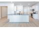 Spacious kitchen featuring a large island with seating, stainless steel appliances, and ample cabinet space at 549 Honeyhill Loop, Conway, SC 29526