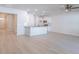 Bright, open floorplan living room and kitchen with white cabinets and stainless appliances at 549 Honeyhill Loop, Conway, SC 29526