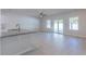 Open floorplan living room featuring a ceiling fan and sliding glass doors to the backyard at 549 Honeyhill Loop, Conway, SC 29526